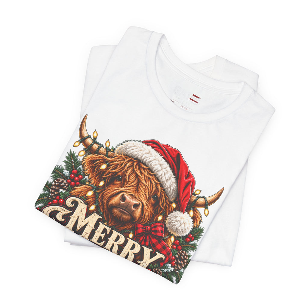 Folded white Highland cow Santa hat Merry Christmas graphic T-shirt, print close-up