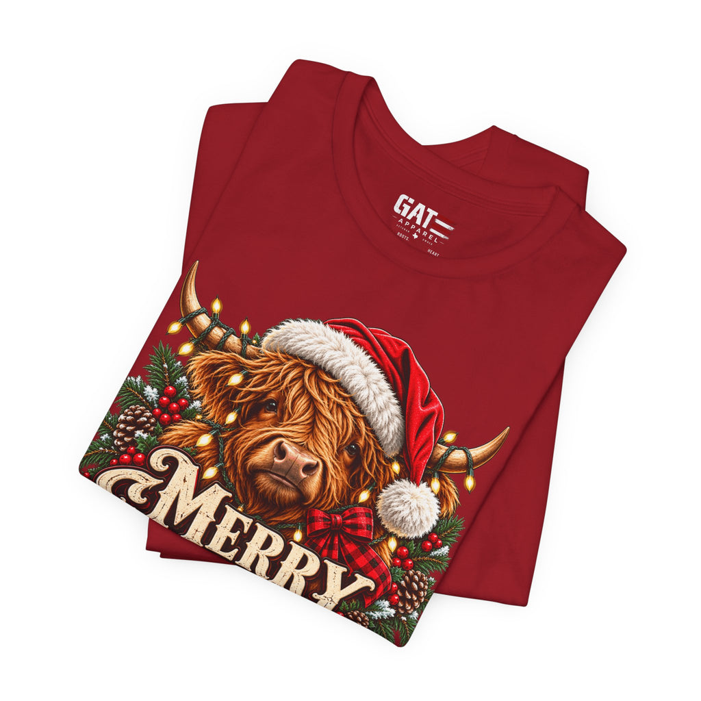 Folded red Highland cow Santa hat Merry Christmas graphic T-shirt, print close-up
