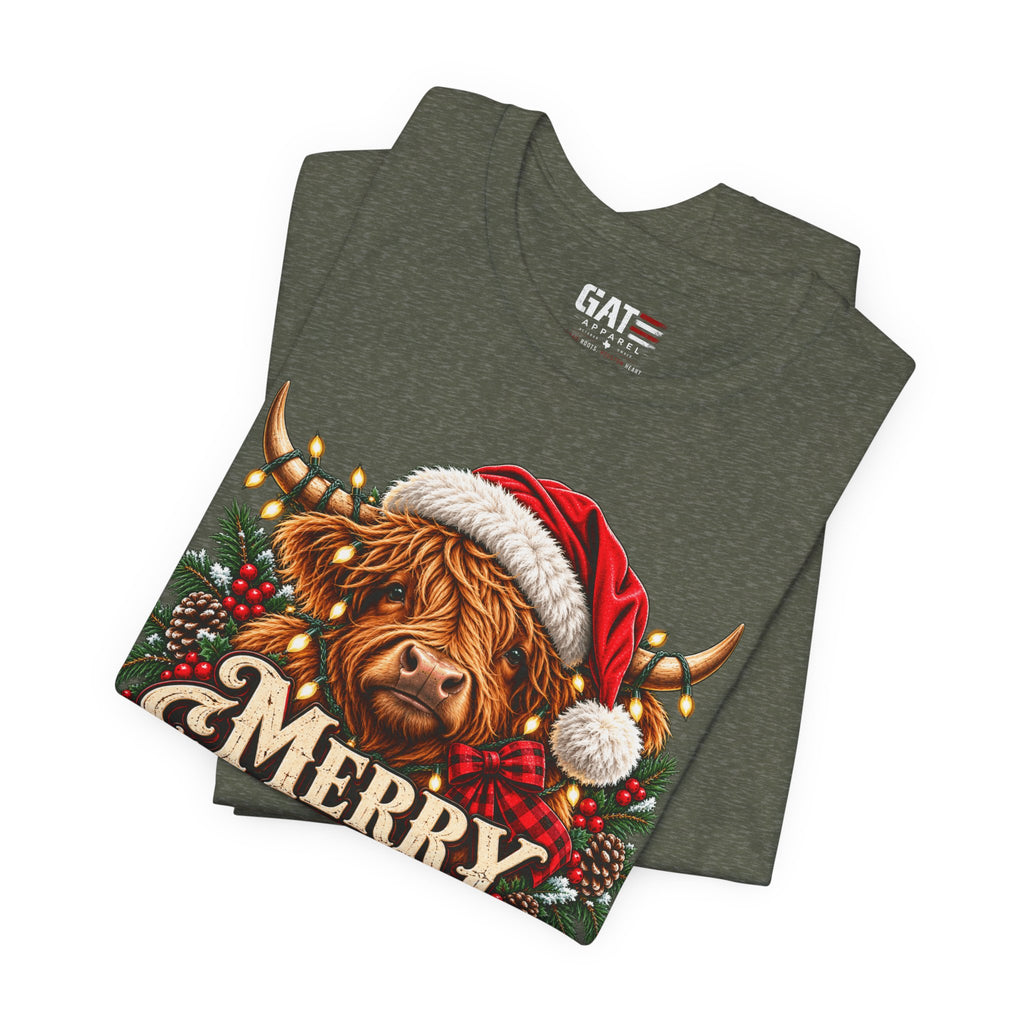 Folded olive green Highland cow Santa hat Merry Christmas graphic T-shirt, print close-up
