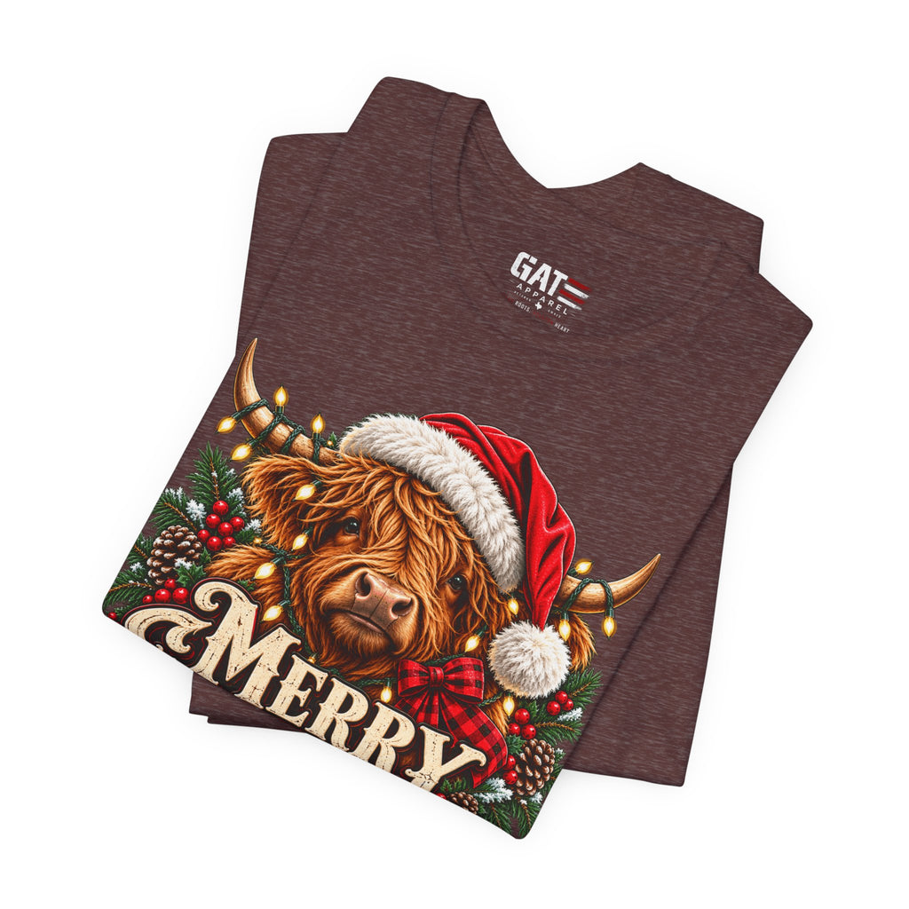 Folded brown Highland cow Santa hat Merry Christmas graphic T-shirt, print close-up