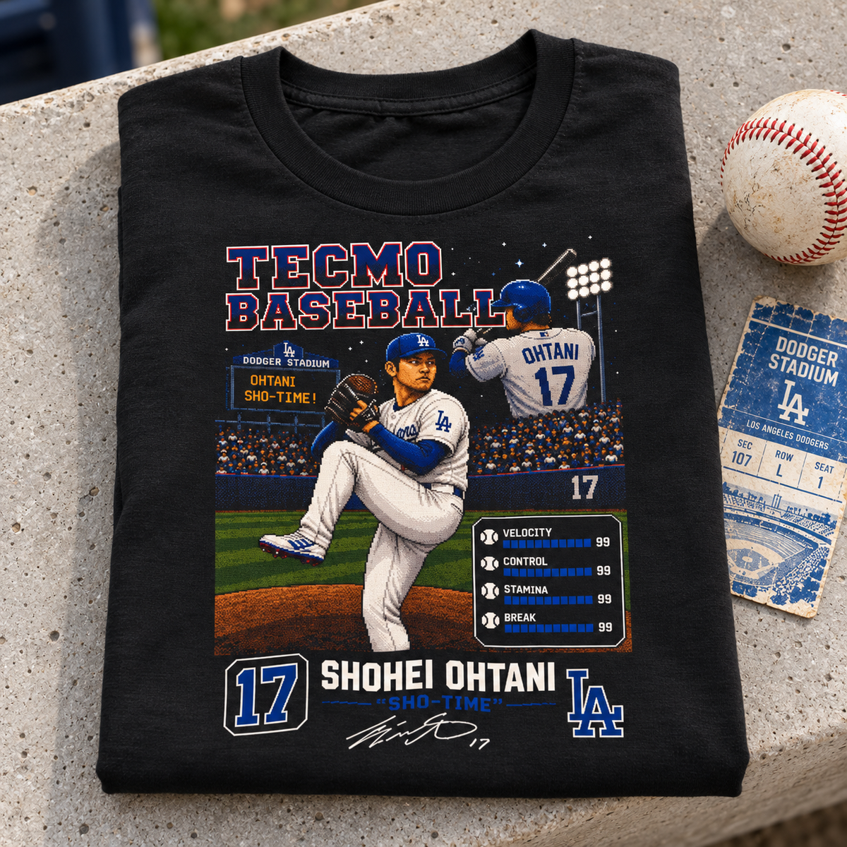 Los Angeles Dodgers – Shohei Ohtani – Tecmo Baseball Shirt | Retro Arcade Tee — close-up folded lifestyle mockup with upper-chest graphic