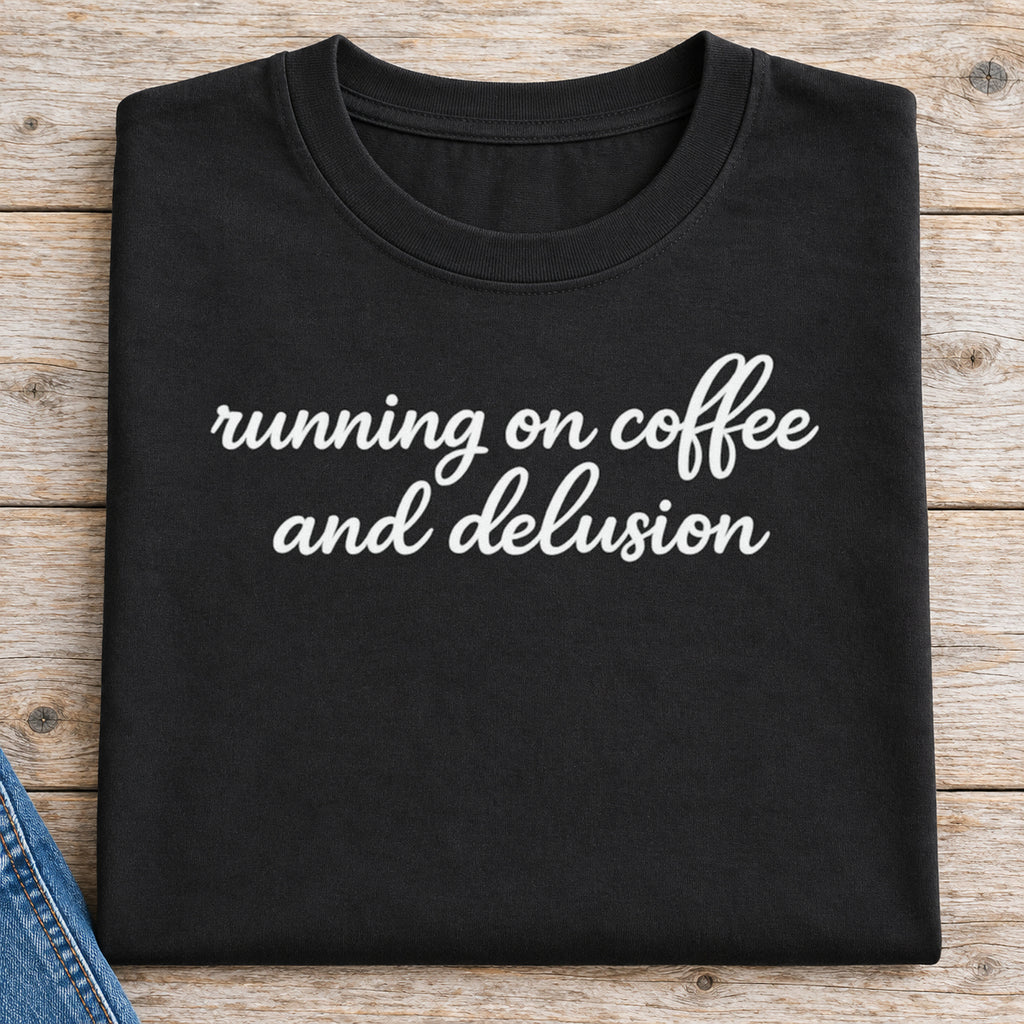 Running on Coffee and Delusion Shirt | Funny Coffee Tee — folded shirt with original artwork