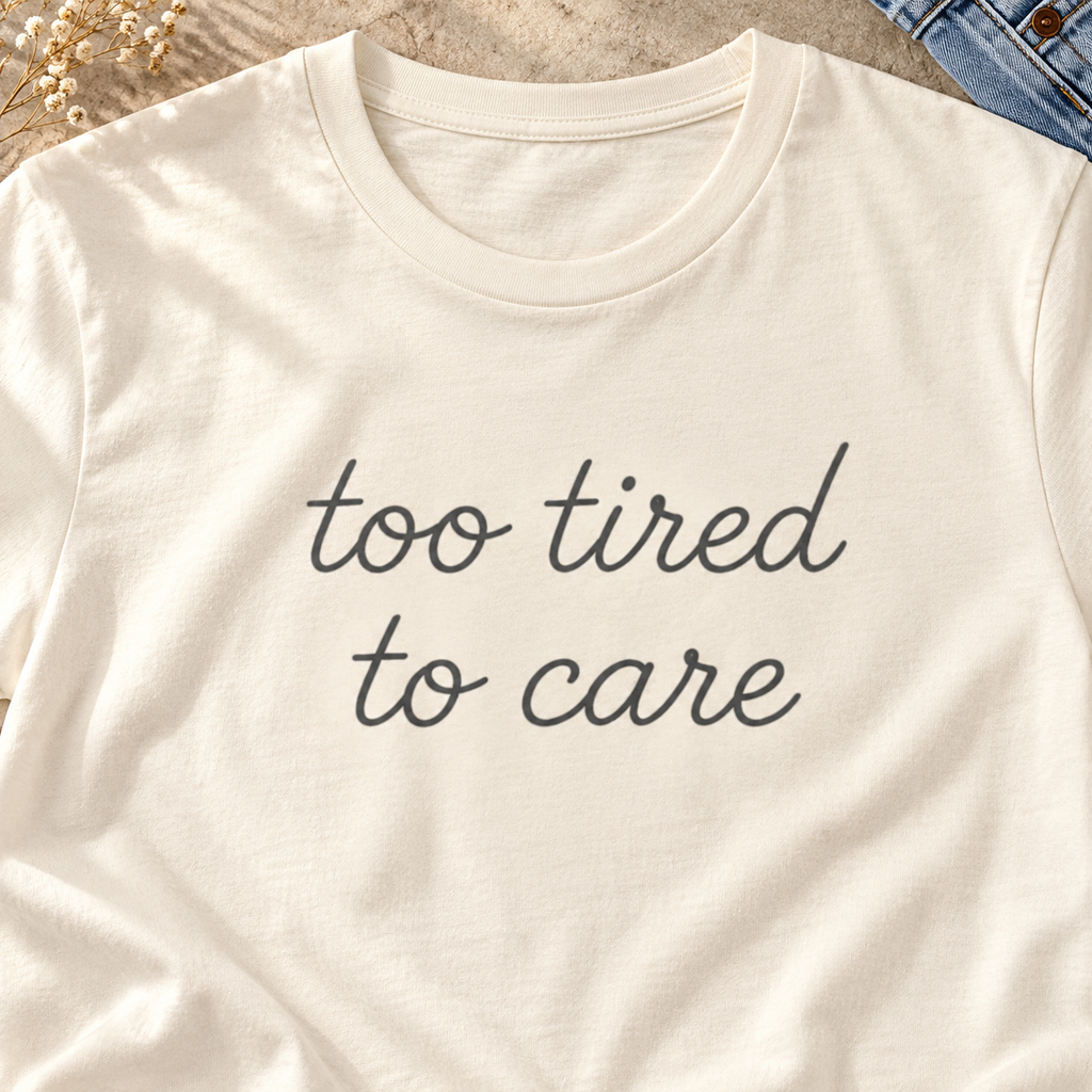 Too Tired to Care Shirt | Funny Introvert Tee — close-up lifestyle flat lay