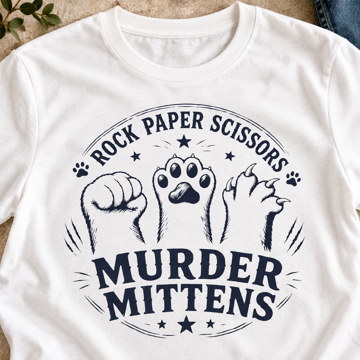 Murder Mittens Cat Shirt | Rock Paper Scissors Tee — close-up lifestyle flat lay