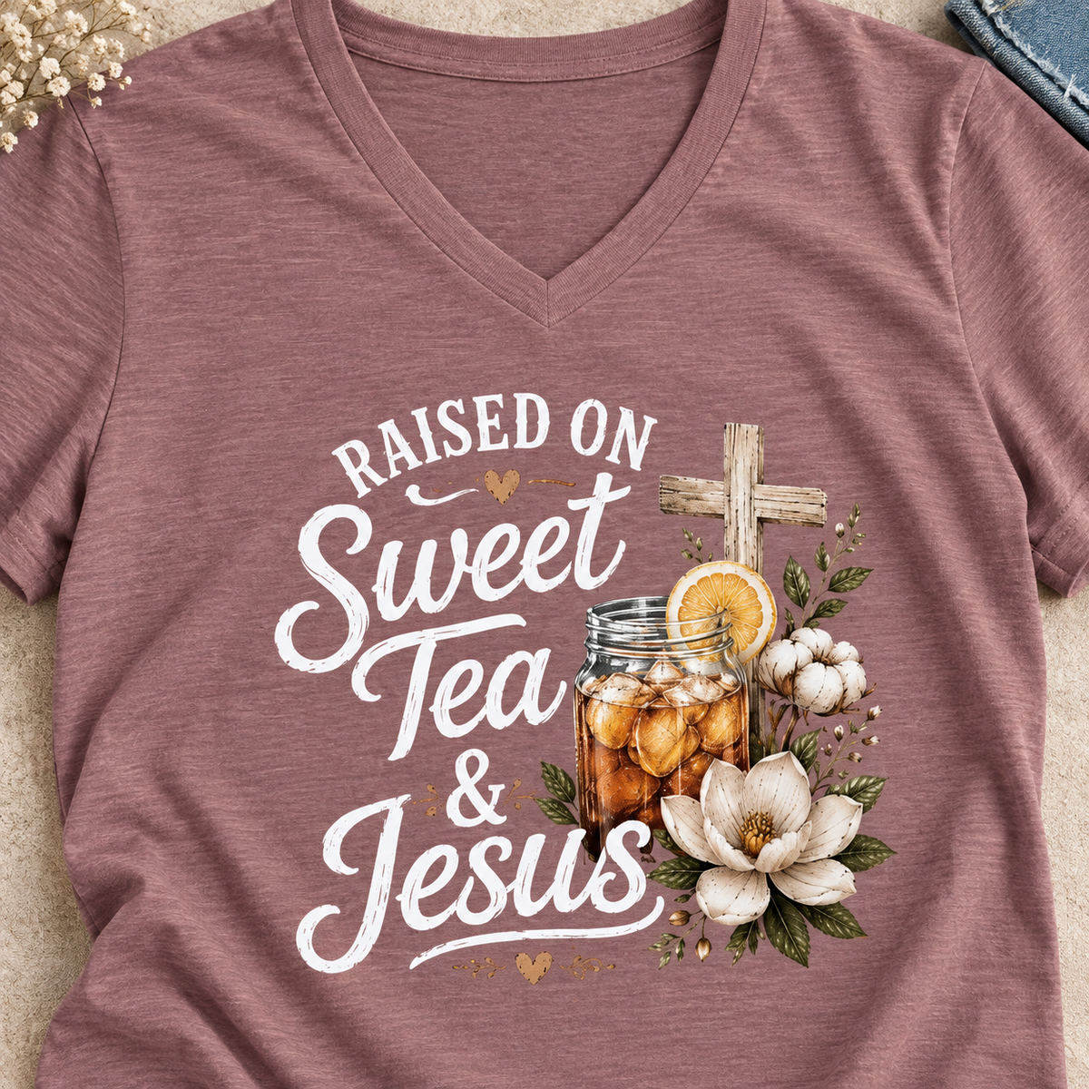 Raised on Sweet Tea & Jesus V-Neck Shirt — close-up lifestyle flat lay
