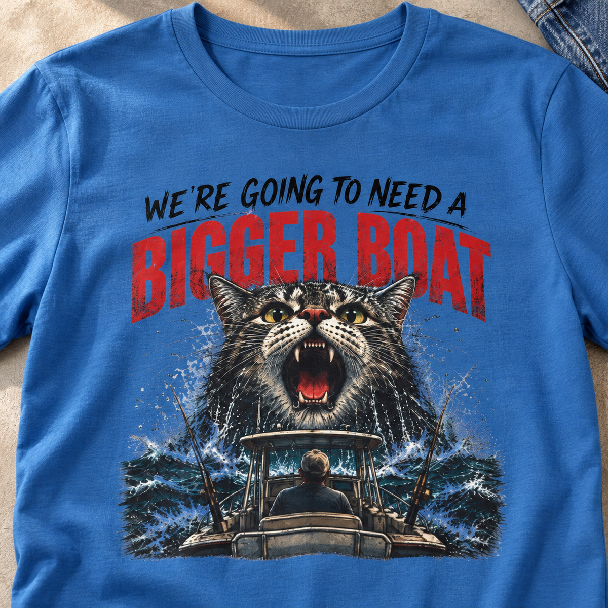PAWS Bigger Boat Cat T-Shirt — close-up lifestyle flat lay