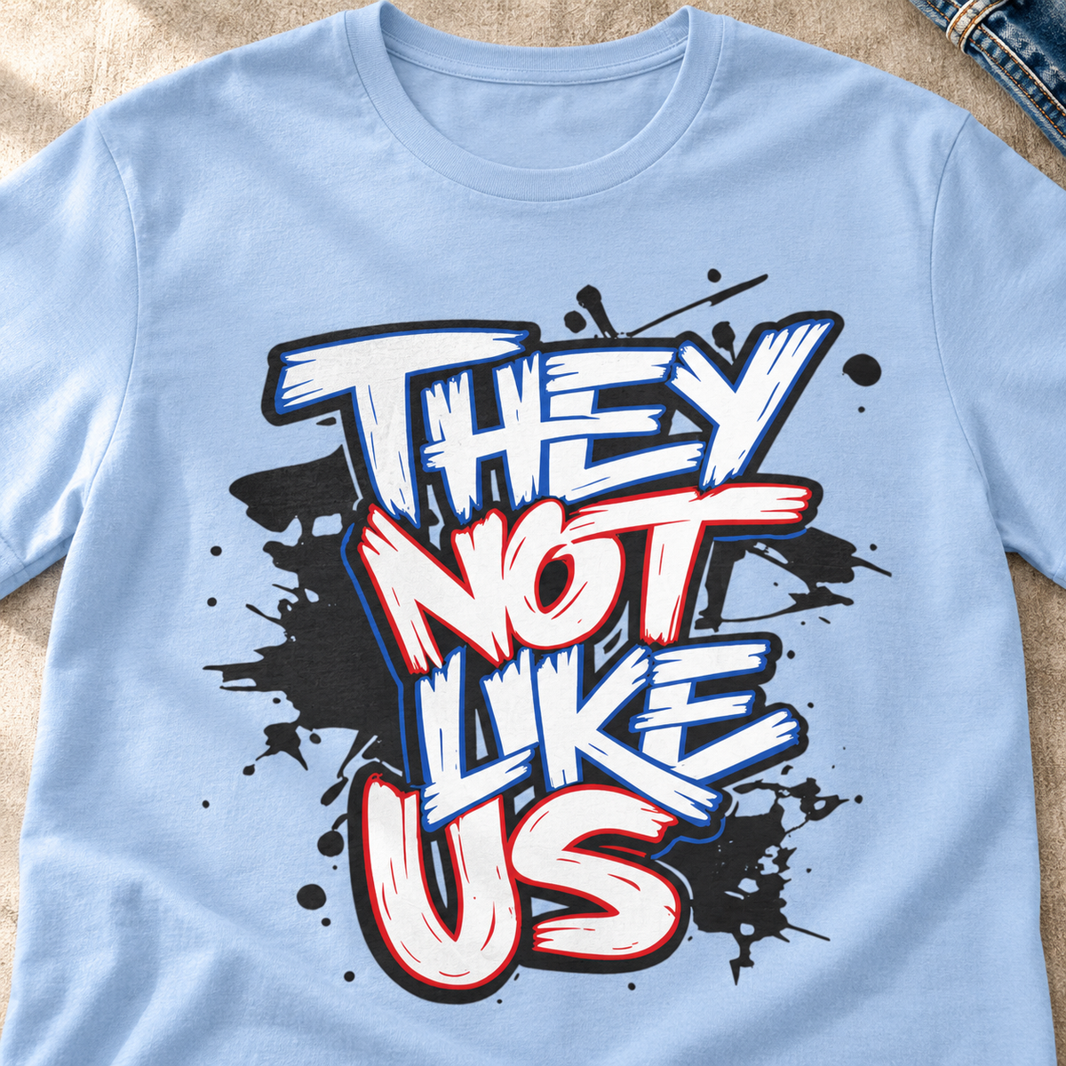 They Not Like Us Graffiti T-Shirt — close-up lifestyle flat lay