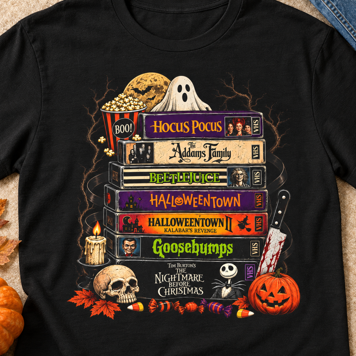 Spooky Classics Halloween Movie Stack T-Shirt — close-up lifestyle flat lay