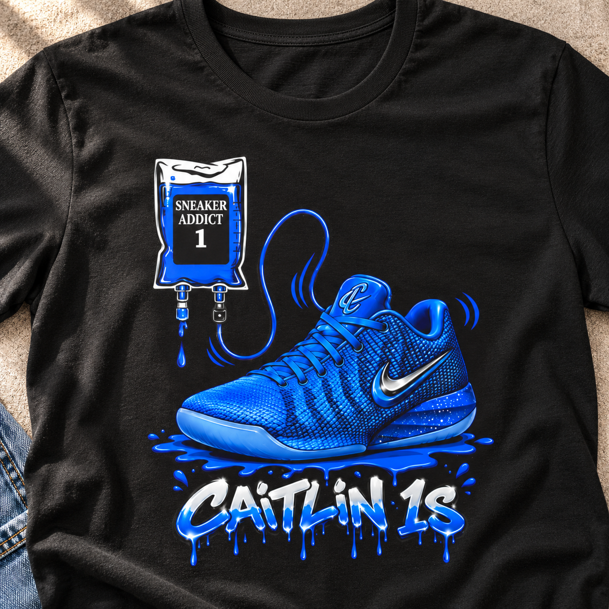 Indiana Fever – Caitlin Clark – Caitlin 1s Addict Blue Sneaker T-Shirt — close-up lifestyle flat lay