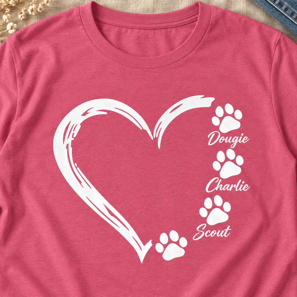Personalized Pet Paw Heart Shirt | Custom Dog Names Tee — close-up lifestyle flat lay