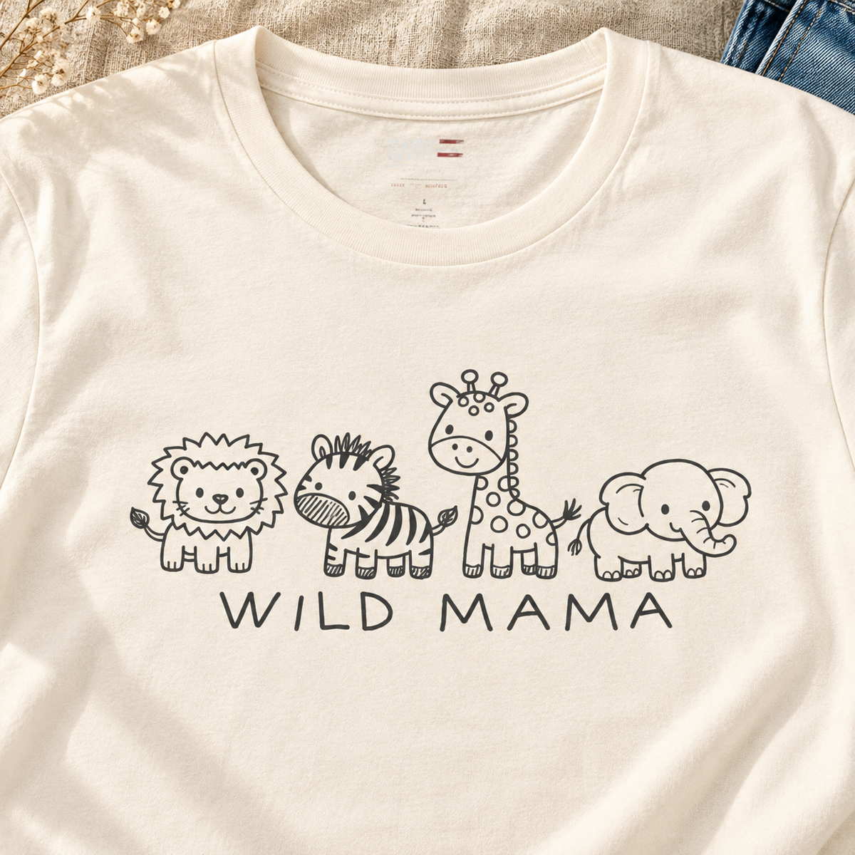 Wild Mama T-Shirt – Cute Baby Animal Graphic Tee for Moms — close-up lifestyle flat lay