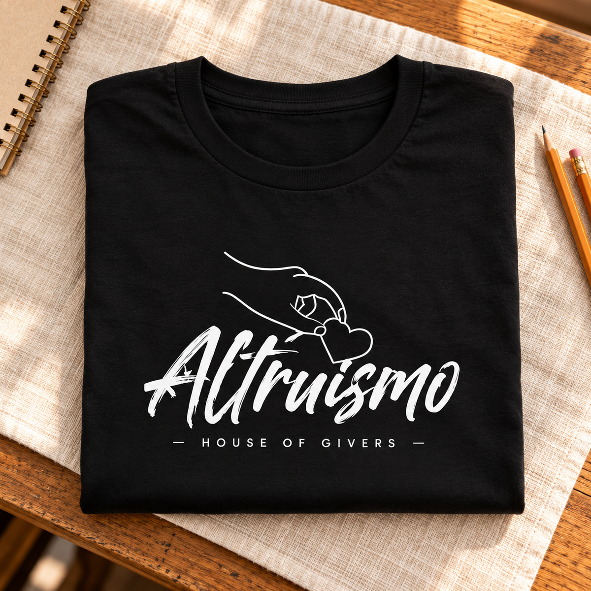 Ron Clark Altruismo Heart T-Shirt — folded lifestyle mockup