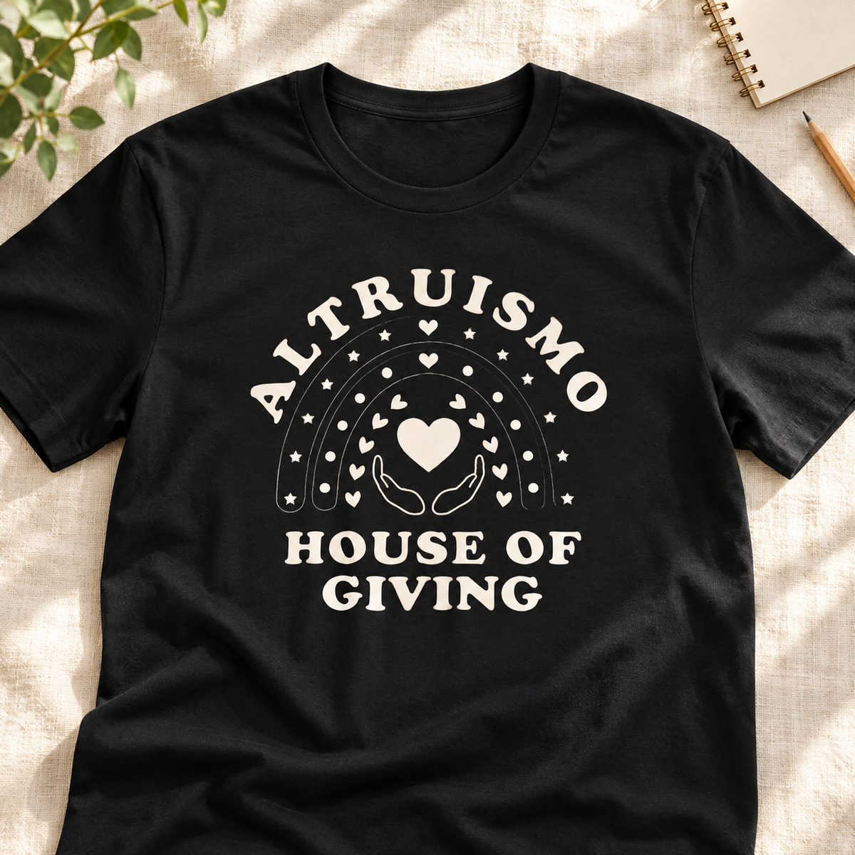 Ron Clark Altruismo Open Hands T-Shirt — layflat lifestyle mockup