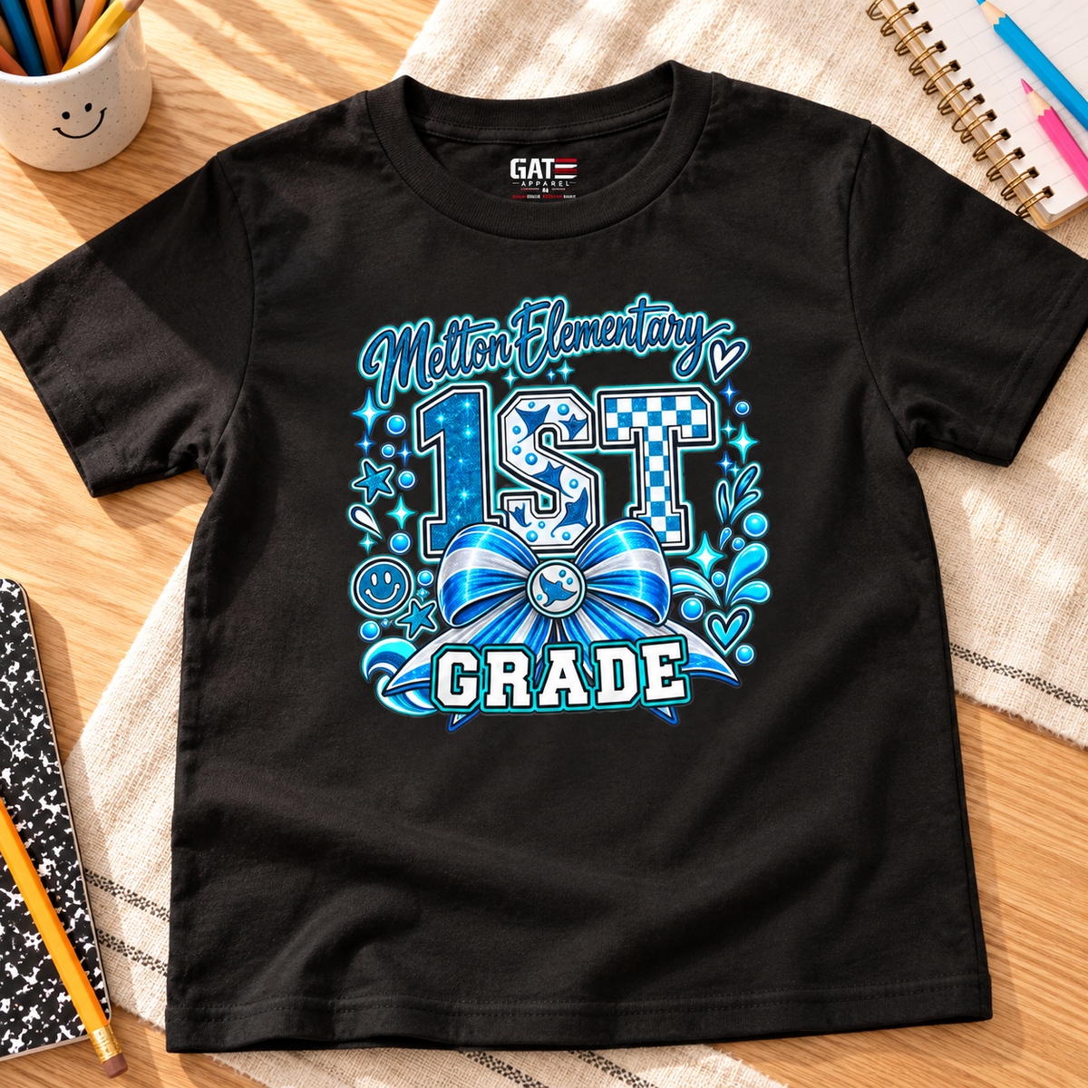 Melton 1st Grade Kids Ribbon Shirt | School Tee — layflat lifestyle mockup