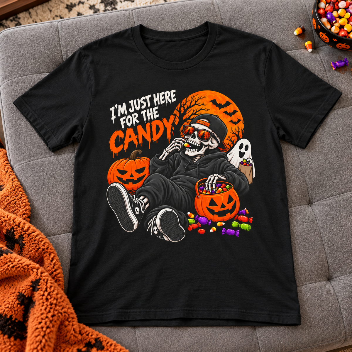 I'm Just Here for the Candy Halloween Skull Shirt | Spooky Tee — zoomed-in lifestyle flat lay