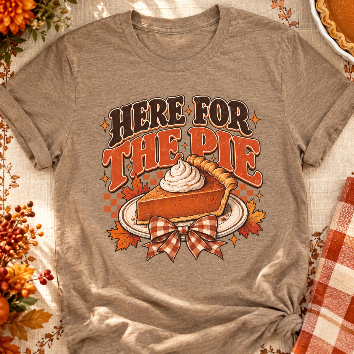 Here For The Pie T-Shirt — Retro Pumpkin Pie Thanksgiving Tee — zoomed-in lifestyle flat lay