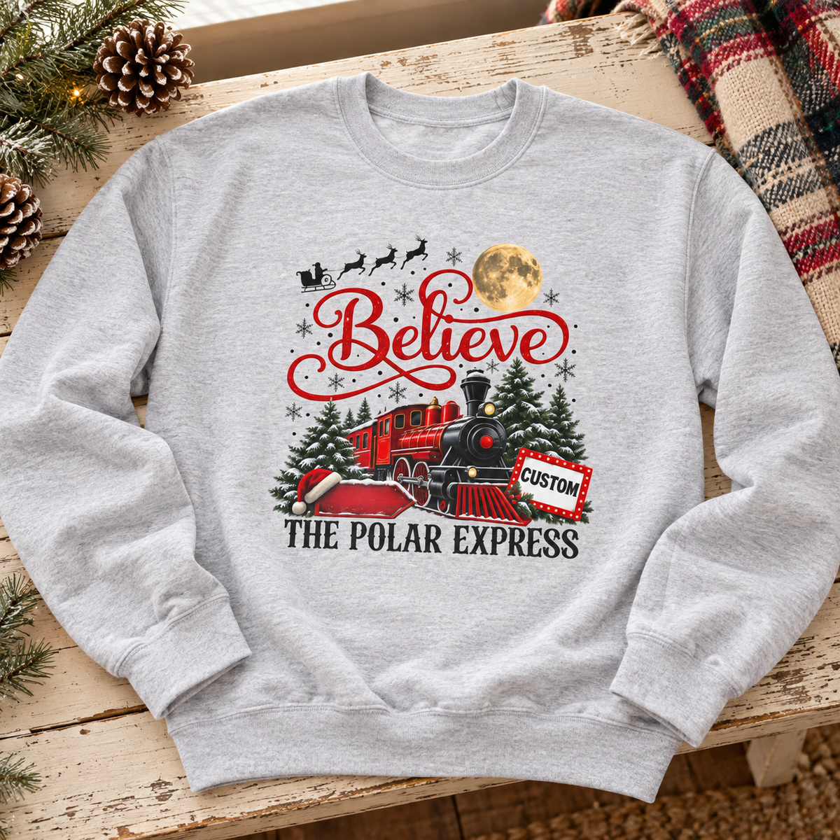 Personalized Polar Express Crewneck Sweatshirt — zoomed-in lifestyle flat lay