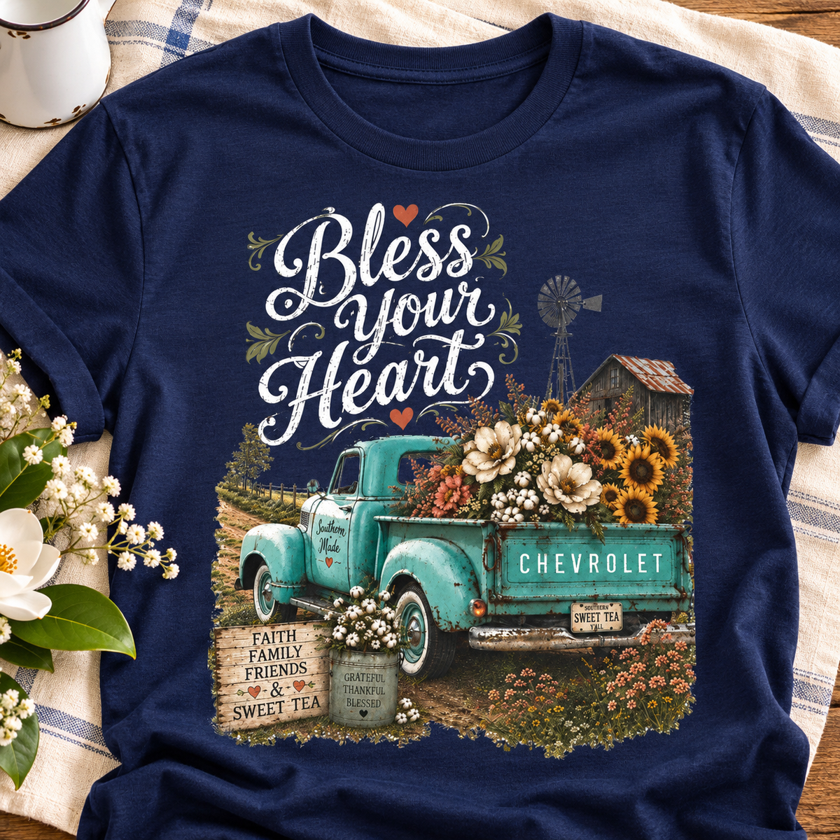 Bless Your Heart Farm Truck Shirt | Magnolia Floral Tee — close-up lifestyle flat lay