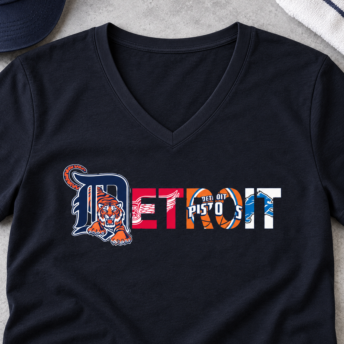 Detroit Sports Team Script V-Neck Shirt — close-up lifestyle flat lay